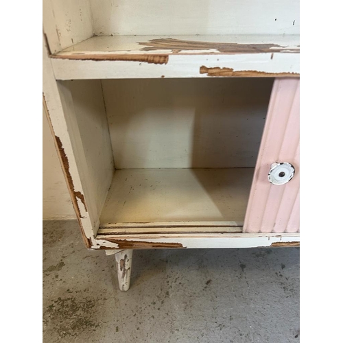 251 - A Mid Century white painted bookcase with two door sliding cupboard under AF (H92cm W61cm D23cm)