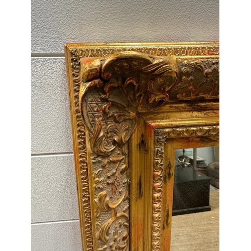 280 - A wooden gold painted hall mirror 99cm x 127cm