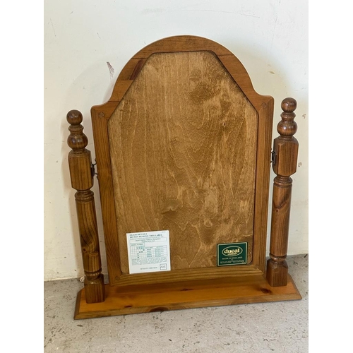 281 - A Ducal pine framed toilet mirror (H64cm)