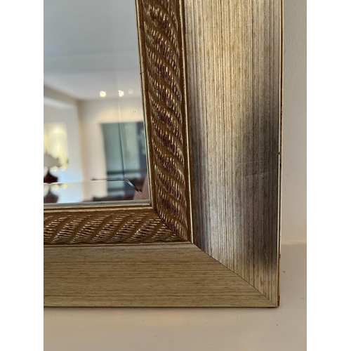 286 - A contemporary wall mirror (110cm x 131cm)