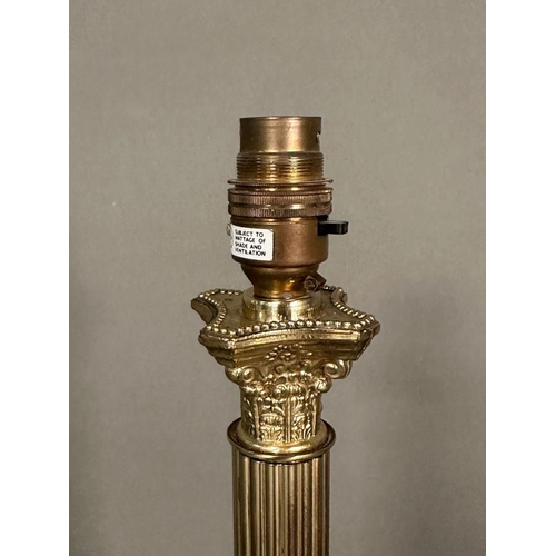 301 - A pair of brass empire column table lamps