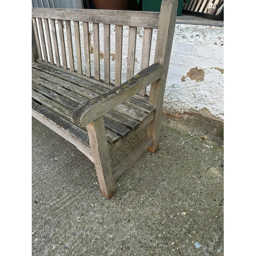 328 - A wooden two seater garden bench (H91cm W150cm D64cm)