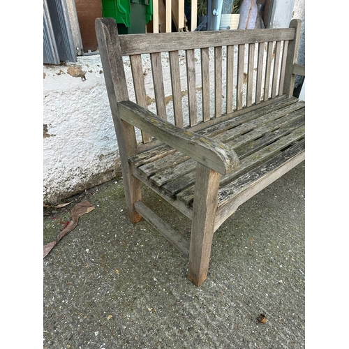 328 - A wooden two seater garden bench (H91cm W150cm D64cm)