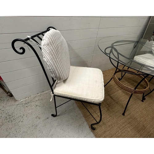 332 - A wrought iron glass top garden table with two wrought iron chair with cream cushions (H75cm Dia99cm... 