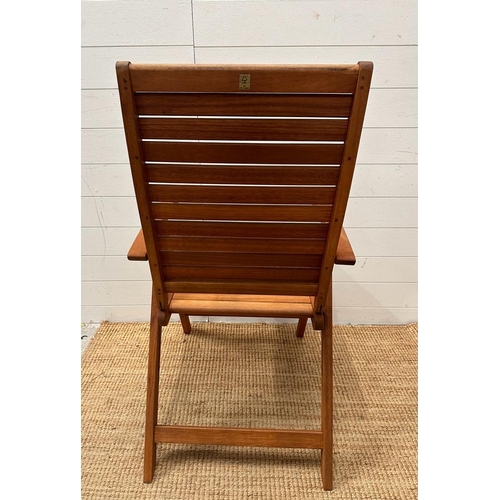 333 - A set of six teak slated folding garden chairs