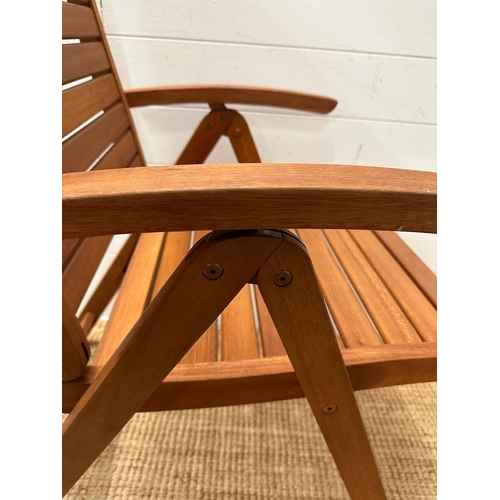 333 - A set of six teak slated folding garden chairs