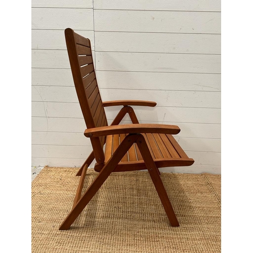 333 - A set of six teak slated folding garden chairs