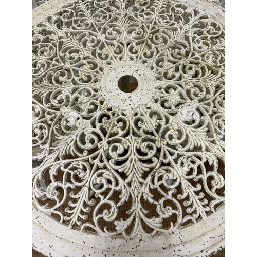 334 - A white painted wrought iron garden bistro set. Table height 63. Diameter 69