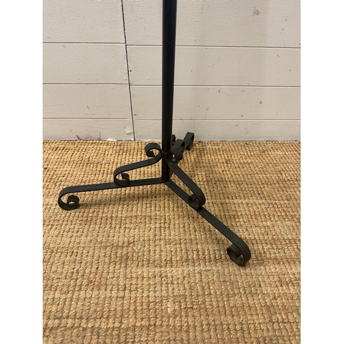 335 - A black wrought iron flower arrangement stand (H132cm)