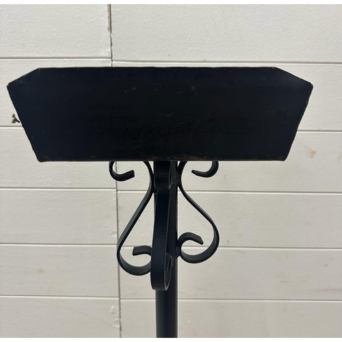 335 - A black wrought iron flower arrangement stand (H132cm)