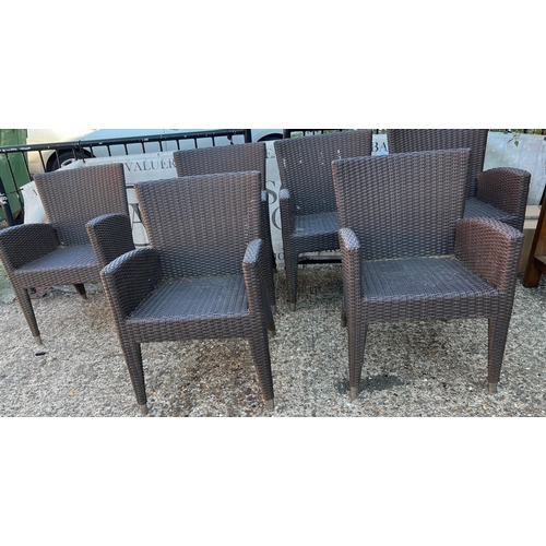 351 - A set of eight garden chairs in a rattan style by Skyline Design UK