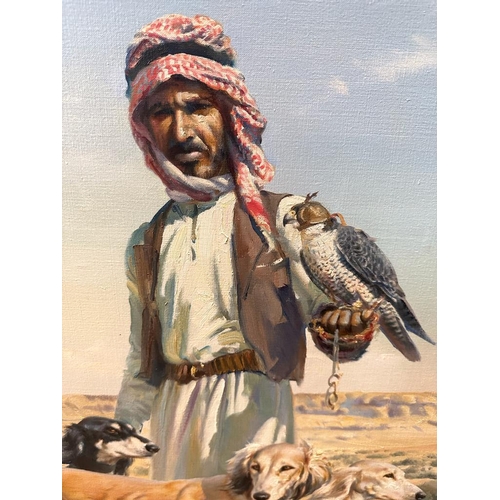 410 - An oil on canvas of a middle Eastern hunter and his dogs by Donald Grant OBE 60cm x 90cm