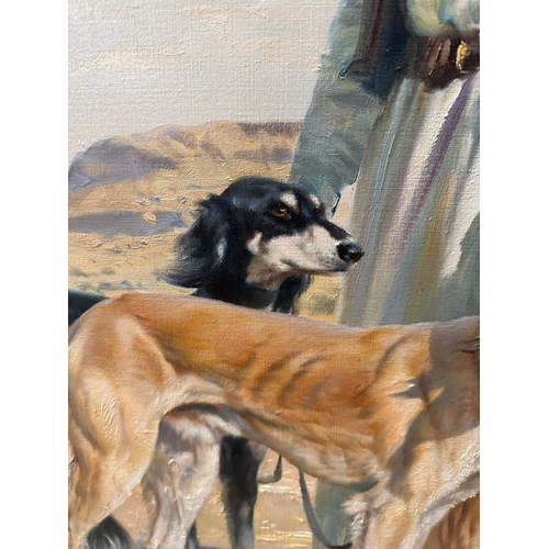 410 - An oil on canvas of a middle Eastern hunter and his dogs by Donald Grant OBE 60cm x 90cm