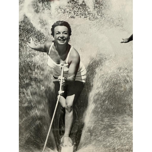 422 - A framed black and white photograph of a 1950's water skiing party 69x49