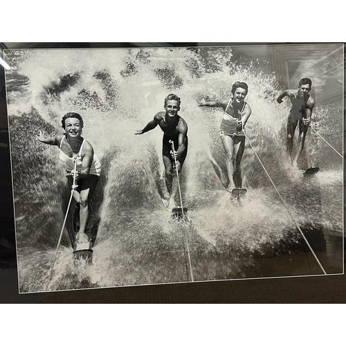 422 - A framed black and white photograph of a 1950's water skiing party 69x49