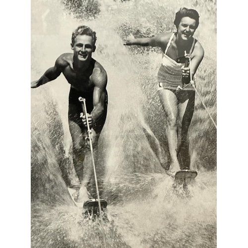 422 - A framed black and white photograph of a 1950's water skiing party 69x49