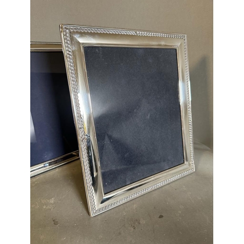 430 - A selection of three silver picture frames, largest is 32 cm x 27.5 cm