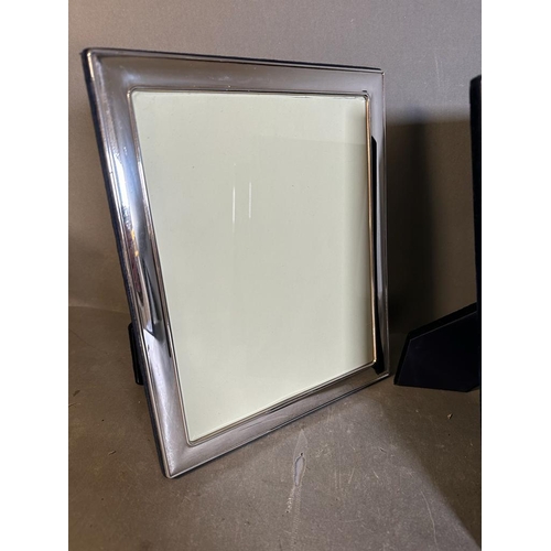 430 - A selection of three silver picture frames, largest is 32 cm x 27.5 cm