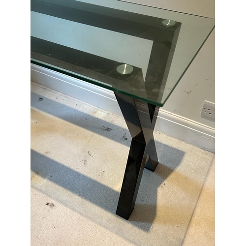 44 - A cross frame console table with glass top