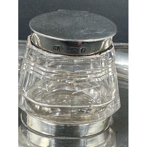 451 - A cut glass inkwell with silver lid on a silver tray both hallmarked for Birmingham 1905