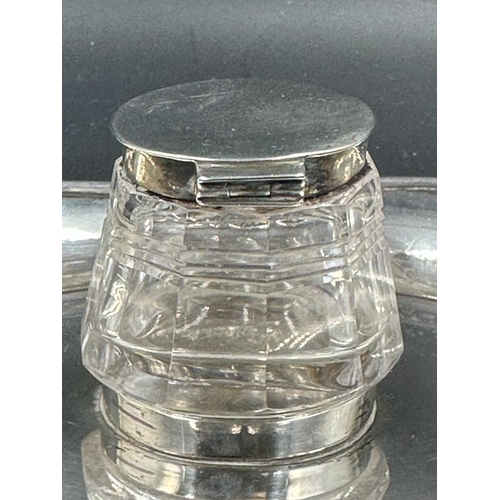 451 - A cut glass inkwell with silver lid on a silver tray both hallmarked for Birmingham 1905