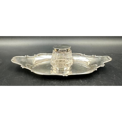 451 - A cut glass inkwell with silver lid on a silver tray both hallmarked for Birmingham 1905