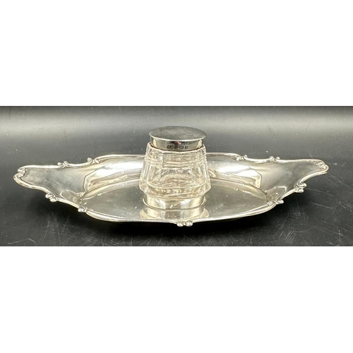 451 - A cut glass inkwell with silver lid on a silver tray both hallmarked for Birmingham 1905