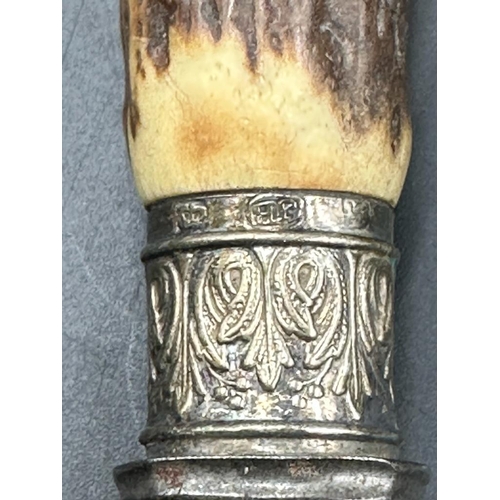 457 - A cased carving set with silver mounts and horn handles