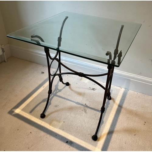 46 - A glass top side table on wrought iron legs (H61cm SQ56cm)