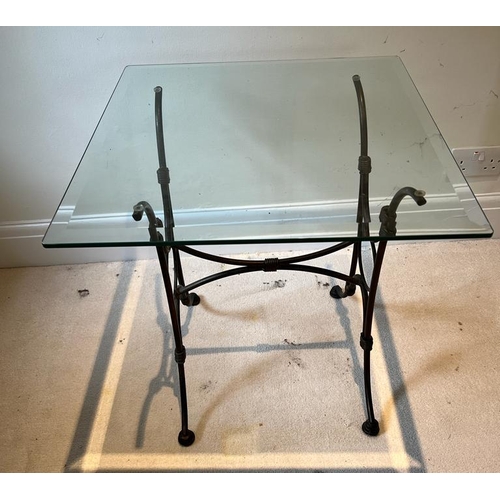 46 - A glass top side table on wrought iron legs (H61cm SQ56cm)