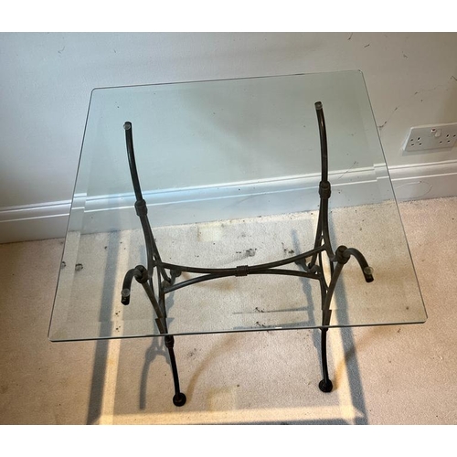 46 - A glass top side table on wrought iron legs (H61cm SQ56cm)