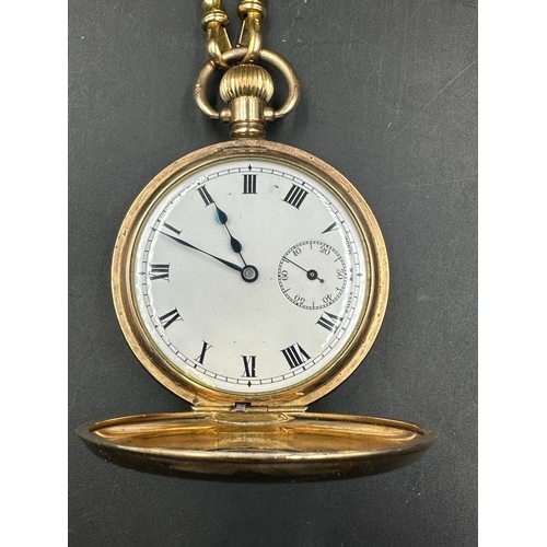 479 - A gold plated half hunter pocket watch on a 9ct gold Albert chain (Approximate weight of chain 38.5g... 