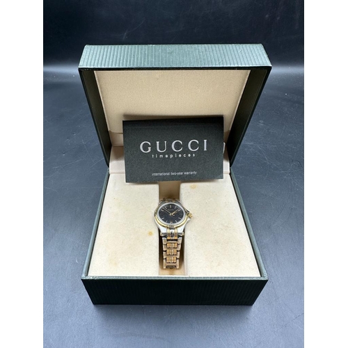 488 - A GUCCI ladies watch in box with papers