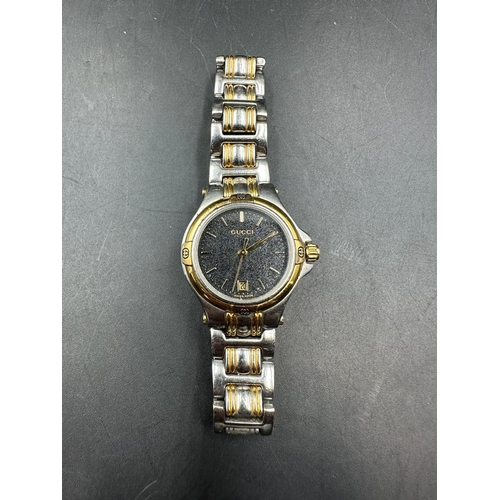 488 - A GUCCI ladies watch in box with papers