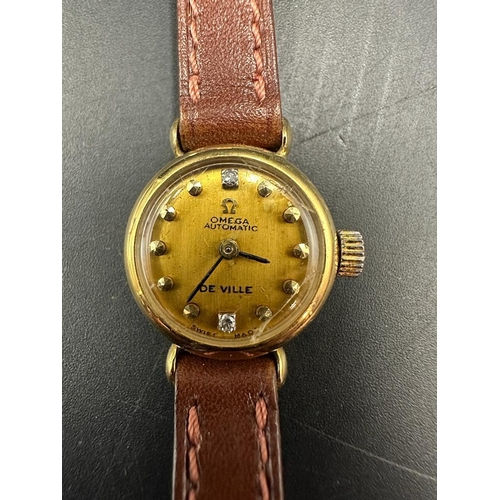 493A - A Ladies 18ct gold Omega De Ville wristwatch, circular gold coloured dial, yellow faceted dot hourly... 