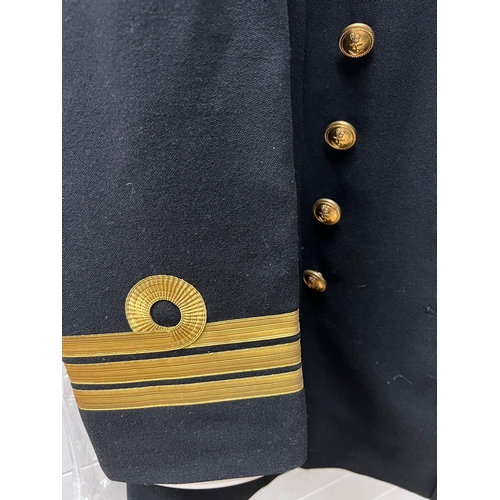 505 - A Royal naval mess dress jacket and naval uniform jacket along with cap