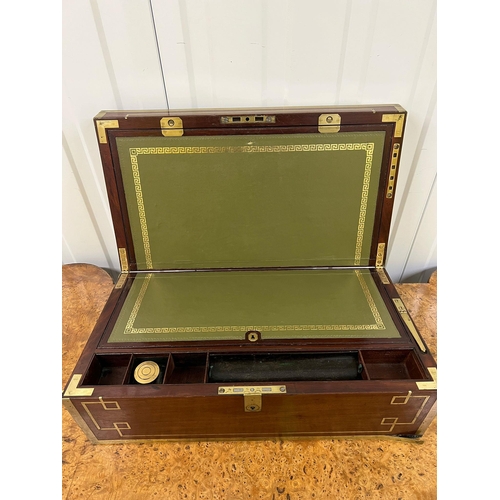 521 - A Regency period mahogany and brass bound campaign writing box 1820 (19cm x 51cm x 28cm)