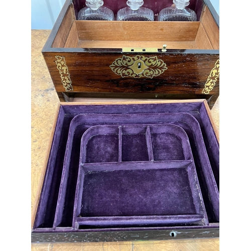 524 - A Ladies vanity box with decorative brass inlay, fitted interior, three original perfume bottles, li... 