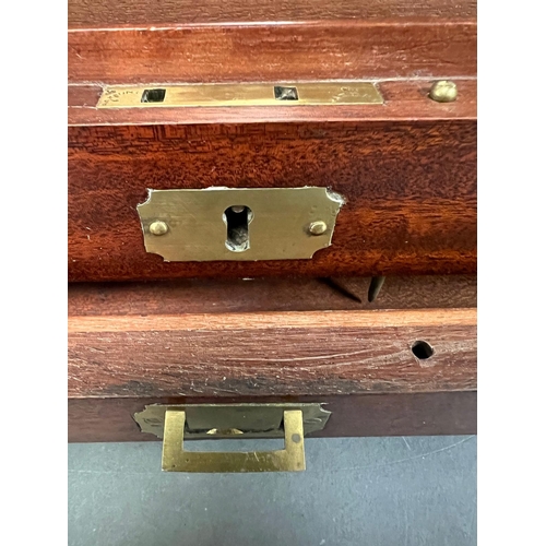 527 - A mahogany campaign box with brass banding opening to leather lined lid and fitted interior