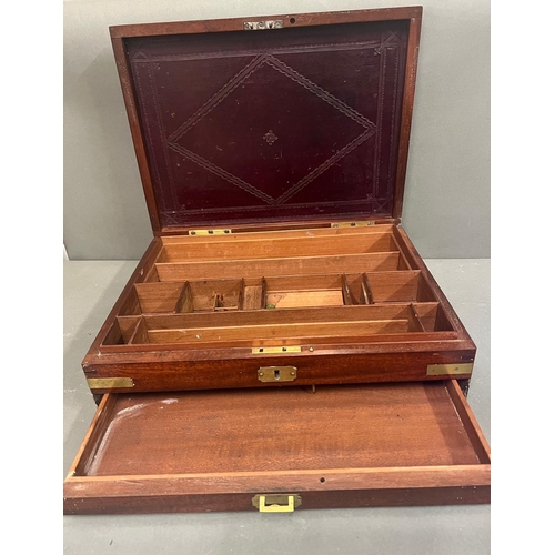 527 - A mahogany campaign box with brass banding opening to leather lined lid and fitted interior