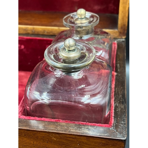 530 - A campaign style brass banded decanter box with four glass and silver topped decanters. Dated 1832 t... 