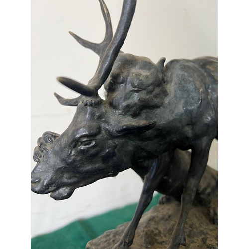 534 - A bronze sculpture of a panther seizing a stag on a marble based, signed (H32cm W30cm)