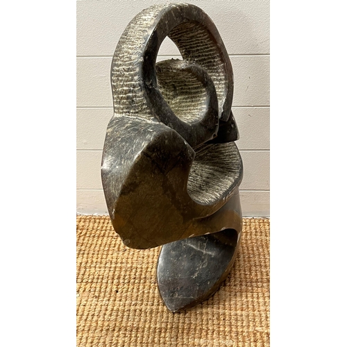 537 - A polished stone African stylised sculpture (78cm H x 40cm W)