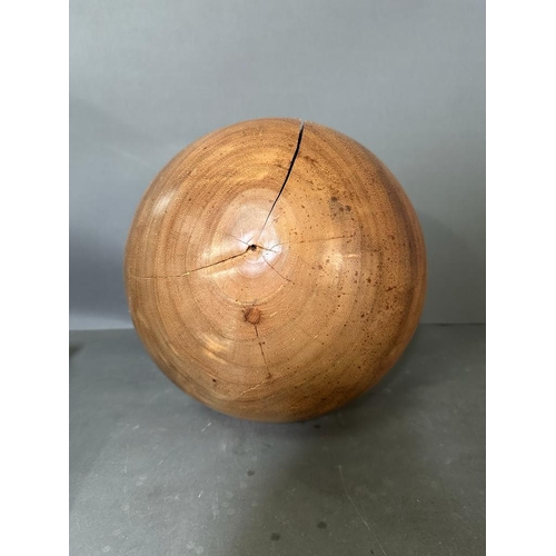 540 - A large contemporary sculptural wooden ball