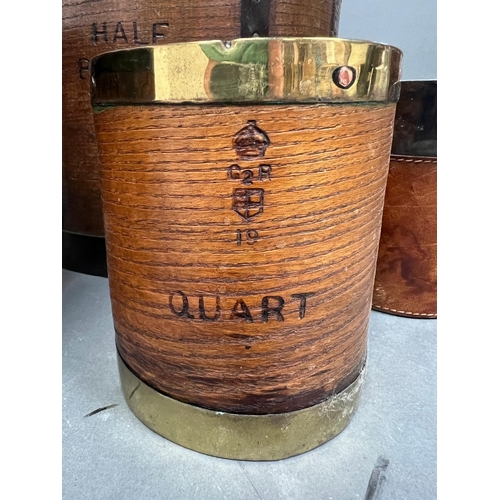 549 - A selection of five various brass, leather and metal bound barrels, buckets etc.(Tallest 30cm)