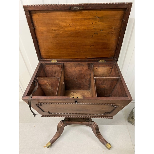 55 - A Regency style Cellarette. The Mahogany caddy opening to compartments and panelled front. Terminati... 