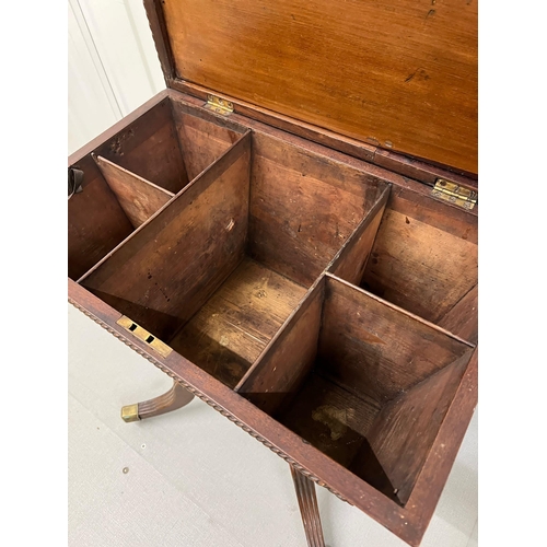 55 - A Regency style Cellarette. The Mahogany caddy opening to compartments and panelled front. Terminati... 