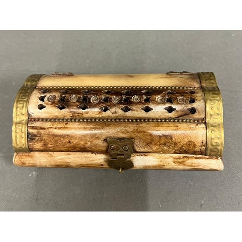 550 - A Bone carved trinket or jewellery box with brass fittings