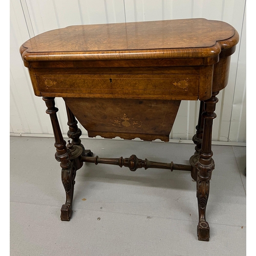 56 - A Victorian Burr Walnut Games Table. The table top opens to reveal Chess, back gammon and cribbage b... 