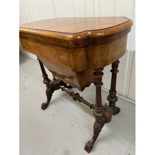 56 - A Victorian Burr Walnut Games Table. The table top opens to reveal Chess, back gammon and cribbage b... 